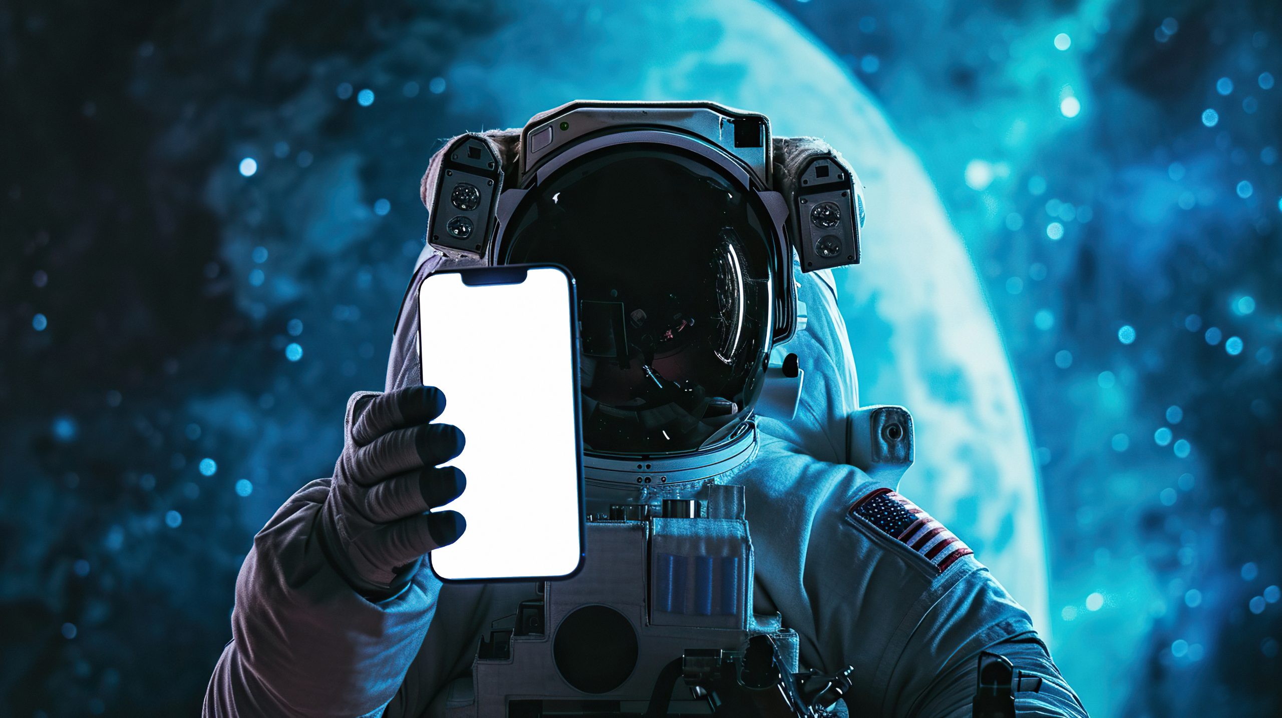 An astronaut holding smartphone with empty white screen in front of him in open space